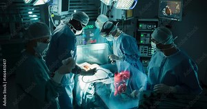 Diverse Team or Surgeons in a Modern Operating Room Using Augmented Reality Technology, Projecting 3d AR Hologram with Human Anatomy Before Performing an Emergency Treatment Procedure in Hospital
