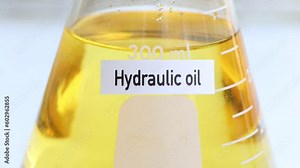 hydraulic oil in container, science experiment concept