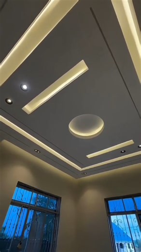 Designer Ceiling | Plaster | Drywall on Instagram: "Minimal, modern, and balanced🏡⚡ The mix of straight lines and one soft circle keeps the ceiling interesting without looking busy. Rectangular double layer tray ceiling. The outer frame is raised and the inner panel is slightly recessed. Mai Outer Tray Frame A continuous rectangular border runs around the ceiling. Inner Flat Panel The center area is kept plain and clean so the other design elements stand out. Central Circular Feature A round fl