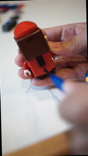 Removing battery from Lego Mario