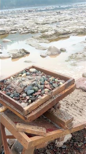 Riverbed Mining: Sifting Stones with a Traditional Rocker Box