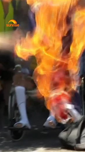 AUSTRALIA FLAG BURNED Protestor sets fire to national flag during Australia Day Protest FOR MORE WATCH SUNRISE I @7plus #sunriseon7 #7plus #australiandayprotest | Sunrise