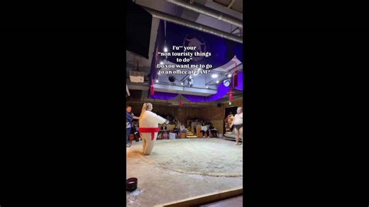 Woman in inflatable suit takes on sumo wrestler — and he fights back like a ballerina
