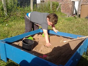 Raised Sand Box With Lid Made From Treated Fence Boards.
