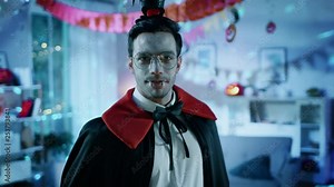 Halloween Costume Party: Count Dracula Revealing Himself From Under The Cape. In the Background Thematically Decorated Room with Scary Stuff. Deadly Blue Colors