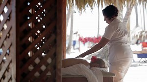 Massage therapist finishing spa treatment