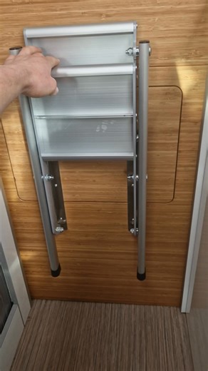 Evo Motion Design on Instagram: "The Folding Aluminium Bed Step available now on our online shop. Designed to make getting into your garage-style bed easy, simple and safe. Our ladder folds flat for compact storage and is strong enough for everyday use. Built from durable aluminium, it’s lightweight without compromising strength, saving valuable space in your van conversion. Key features: • Space-saving fold-flat design for easy storage • Strong and lightweight aluminium construction • Ideal for
