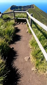 In Japan, Aogashima is a surreal volcanic island in the Philippine Sea, essentially a "volcano within a volcano," where a secondary cone sits inside a massive, sheer-walled outer caldera, creating a secluded and prehistoric landscape inhabited by a tiny, isolated community. #travel #japan | Japan Hidden Gems