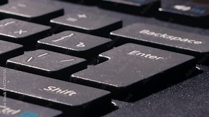 the finger presses the enter key several times. various pressing of the enter key. single clicks.