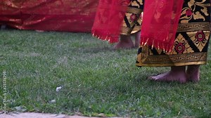 Two girls dance traditional Bali dance in traditional dresses