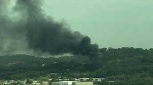 Towering plume of dark smoke seen from afar after pallet fire off Middlebrook Pike