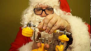Funny fat Santa Claus talking on an old telephone.