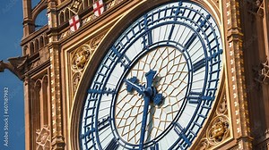 Big Ben clock tower on a sunny early morning in London, UK. A view of the popular London landmark, the clock tower known as Big Ben, showing 3pm as the time set against a blue and cloudy sky.