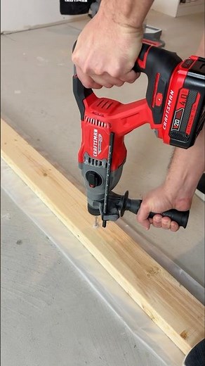 Using the Craftsman 20V Rotary Hammer to pre-drill for a partition wall bottom plate. Smooth. #diy