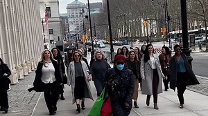 'Sect and the city': Striking photo shows bosses of 'orgasm cult' OneTaste leave NYC courthouse with female entourage, after two of them were charged with forcing women into sex acts