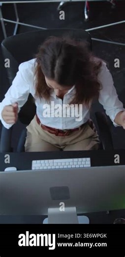 A determined woman typing skillfully on a keyboard in a contemporary office setting, highlighting her productivity Stock Video Footage - Alamy