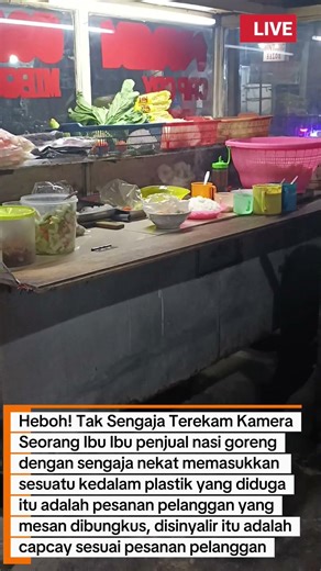 Heboh! Sebuah rekaman amatir seorang ibu ibu pedagang nasgor nekat membungkus pesanan