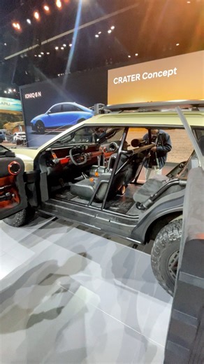 The Hyundai CRATER Concept at the LA Auto Show, and this rugged EV concept really redefines what “adventure” looks like. The CRATER is built on Hyundai’s XRT design philosophy, with a bold, boxy silhouette inspired by extreme terrain that feels like a true off-road warrior. It rides on massive 33-inch all-terrain tires, features a lifted suspension, and includes a heavy-duty skid plate built for serious exploration. The lighting setup is wild — pixel-style lamps give it a futuristic, industrial 