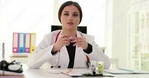 Doctor endocrinologist showing how to use glucometer 4k movie slow motion