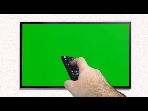 TV with green screen is switched on with remote control - free use