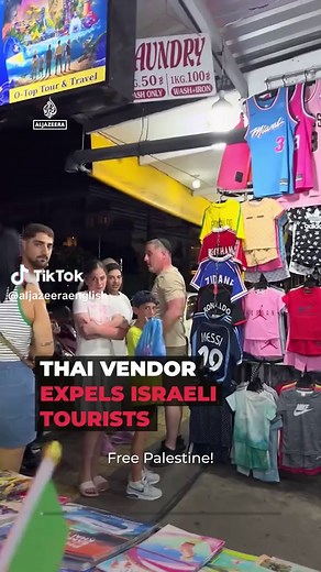 A Thai vendor confronted Israeli tourists outside his shop on the island of Phuket, waving a Palestinian flag and chanting ‘Free #Palestine’ before asking them to leave. He said he was provoked by one of the group, who’d been shouting ‘Free #Israel’. . #News