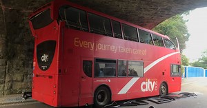 Bus wedged beneath Cornwall bridge freed