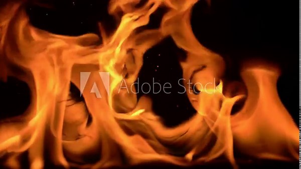 Fire flames with transparent overlay on black background for design and visual effects