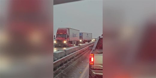 Trucks struggle to gain traction on icy 210 Bridge