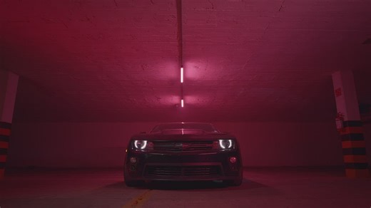 Stylish woman posing around a Camaro car - Free Stock Video