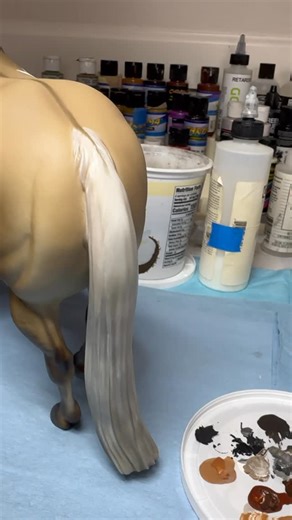 Half Fast Farms Studio on Instagram: "Work on the mane and tail today. I had some extra paint mixed up from the little KS Lola stablemate so went over to this guy. Acrylics mixed with airbrush medium and Golden retarder to create glazed over the airbrushed base colors. He’s a dunalino overo and has many colors in his mane and tail. More layers will go over this to create depth and detail. #Artistresinmodelhorse #halffastfarms #mylapearce #modelhorses #modelhorsesofinstagram #modellpferd #customm