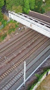 Download Aerial View of British City and Train Tracks for free