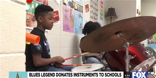 Mac Arnold, fellow musicians bring donated instruments and encouraging words with students