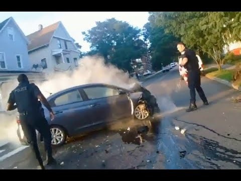 Body Cam: Injured Mass. police officers rescue girl from burning stolen car, chase down 2 suspects