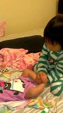 Maggie changing babys diaper