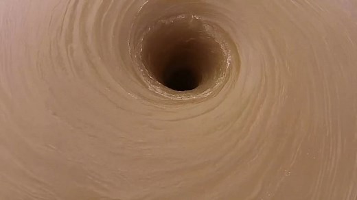 Watch 8-Foot Vortex Spin in Draining Texas Lake