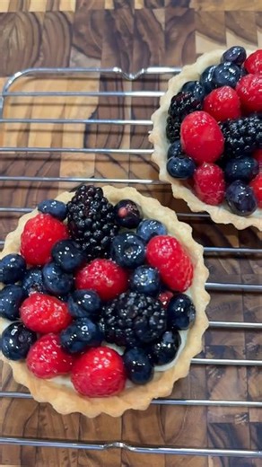 Catherine Pla on Instagram: "Mini Berry Tarts. These impressive-looking tarts are delicious, but actually pretty easy to put together: blind bake the pastry crust, fill it with pastry cream, top with fruit. I’ll show you how to make pastry cream in a reel very soon. Makes about 6 4-inch tarts. ½ recipe tart dough (recipe below) 1 c pastry cream 2 c fresh berries (strawberries, blueberries, raspberries, blackberries) 3 T apricot jam or marmalade If not already made, prepare pastry cream and tart 