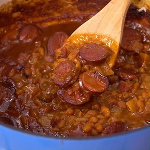 Baked Beans with smoked sausage are super meaty and thick. Lots of sweetness from brown sugar, molasses, and ketchup. Recipe: https://spicysouthernkitchen.com/baked-beans-with-smoked-sausage/ | Spicy Southern Kitchen