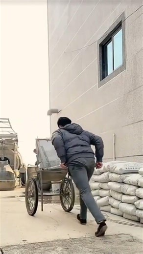 the process of moving cement sacks using a transport tool is easy and fast #construction #popular