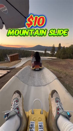 Alex and Nat on Instagram: "$10 Mountain Slide 🎢 Race down the mountain in Big Bear! 🌲 Control your speed - fly down fast or cruise slow🛷💨 🗓️ Saturday - Sunday ⏰ 10 AM - 6 PM 🎟️ Only $10 per ticket ❤️Follow us for more things to do on IG @tildeathdouspart2 and TikTok 📍 Alpine Slide at Magic Mountain 800 Wildrose Ln, Big Bear Lake, CA 92315 #thingstodo #explore #adventure #bigbearlake #alpineslide #bigbear #datenight #socal #couplegoals #dateideas #thingstodoinla #thingstodobigbear #magicm