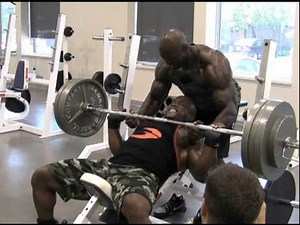 MuscleMag - Ben White flexes his muscle at the MMI gym