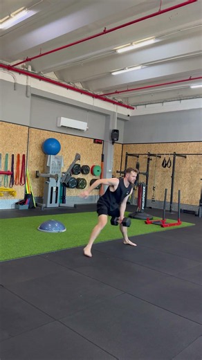 Lateral lunge with movement against dumbbell
