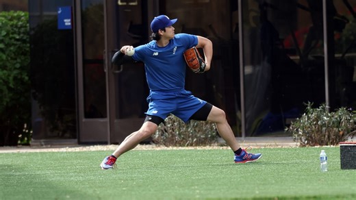 Shohei Ohtani throwing in outfield at spring camp