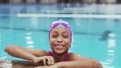 4k video footage of an adorable young girl having a swimming lesson...