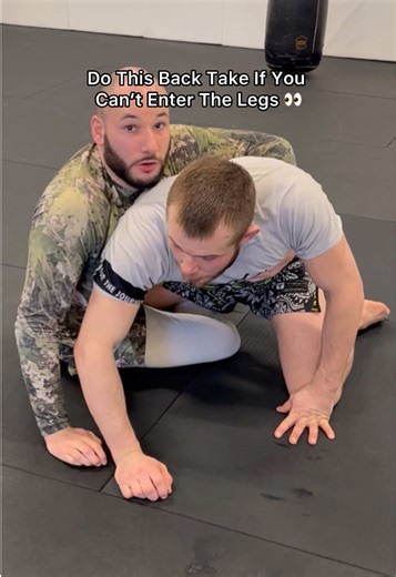 If you are trying to enter the legs and having a hard time you can transition to a arm drag to take the back To do this: 1 Grab your opponent’s tricep and wrist 2 undo your butterfly hook 3 kick your leg out to get momentum 4 climb up to the back 5 get your hooks in If your opponent pulls the arm the leg Presents itself, you can play this dilemma with your opponent #bjj #jiujitus #backtake