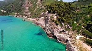 Greece summer holidays. Best beaches of Corfu island. Glyfada beach and village, aerial drone view in western part.