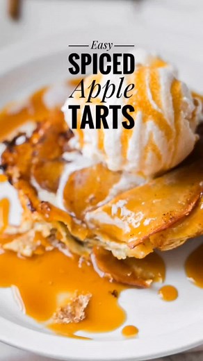 5 ingredient Easy Spiced Apple Tarts These apple tarts are spiced crispy sweet and all the right ways they're exactly the easy dessert you need to welcome fall into your home. Recipe: 11/2 Apples thinly Sliced 1/2 Puff Pastry Package 6 tsp Caramel 1/3 cup sugar 2 tbs Cinnamon 1. Sliced apples thinley toss them in the bowl with two tablespoons of sugar and a teaspoon of cinnamon. Set aside. 2. On a pan with parchment paper sprinkle six spaces with sugar, then about a teaspoon of caramel , then sp