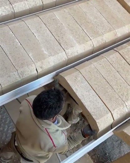 the process of installing brick blocks on the roof of a light steel frame building #construction