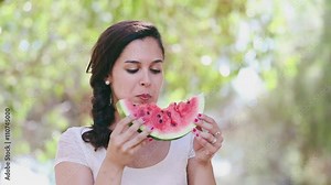 Woman eating watermelon