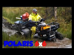 Awesome Polaris 6x6 Sportsman 500 ATV in the woods and in the mud 6 six wheeler with chains