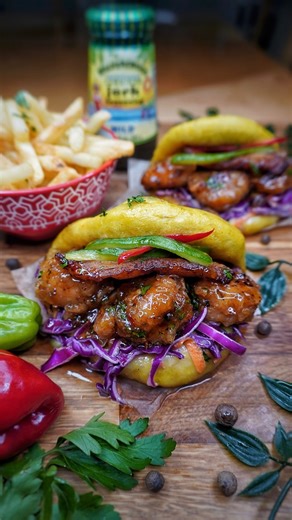 Kay on Instagram: "STICKY CRISPY SWEET CHILLI JERK PRAWN PLANTAIN BAO BUNS 🇯🇲🍯🍤🤯😤🤤💰💸🔥🏆🚦💃🏽. Super flavourful crispy sweet chilli jerk prawns BAO buns. Prawns marinated In the perfect @walkerswood jerk seasoning. Dredge in egg and flour, fried off then smothered in the most irresistible sweet chilli jerk sauce. Then placed in BAO buns made with ripe plantain. Added some coleslaw and cucumber to finish off the buns. OMG this was heaven in every bite. It was soooo good. Absolutely deli